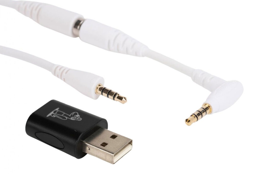 A straight 3.5 mm TRRS cable, a black USB-A audio adapter and a 110-degree angled 3.5 mm cable for SchoolPHONES® school headphones, shown together