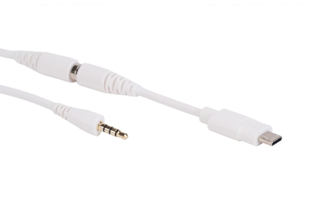 A white 3.5 mm TRRS audio cable and a white USB-C audio cable for SchoolPHONES® school headsets, shown side by side
