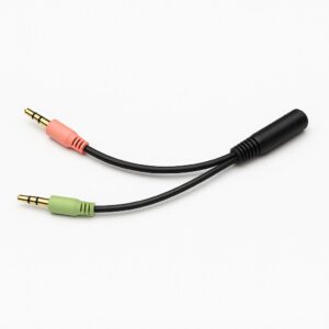 A black audio splitter cable with one female jack and two male plugs—one pink and one green—on a white background.
