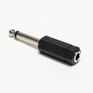 A close-up of a black and silver audio adapter with a 1/4-inch male plug and a 3.5mm female jack, placed on a white background.