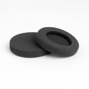 Two round black foam pads are shown on a white surface. One pad is solid, while the other has a circular hole in the center, resembling a thick ring.